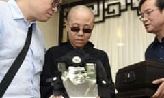 Liu Xia<br>In this July 15, 2017, file photo provided by the Shenyang Municipal Information Office, Liu Xia, center, wife of jailed Nobel Peace Prize winner and Chinese dissident Liu Xiaobo, holds a portrait of him during his funeral at a funeral parlor in Shenyang in northeastern China’s Liaoning Province. A close friend of the late Chinese Nobel Peace laureate Liu Xiaobo has released a recording of an emotional phone call with his widow. Liu Xia has never been charged with a crime, but has been kept guarded and largely isolated since her late husband was awarded the Nobel Peace Prize for his human rights activism in 2010. He was still serving a prison sentence for “subversion” when he died last summer. (Shenyang Municipal Information Office via AP, File)