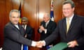 East Timor Foreign Affairs Minister Jose Ramos-Horta and Australian Foreign Minister Alexander Downer shake hands after signing a "Treaty on Certain Maritime Arrangements in the Timor Sea"