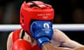 Mongolia's Yesugen Oyuntsetseg is punched by Colombia's Ingrit Lorena Valencia Victoria in the women's 50kg preliminaries round