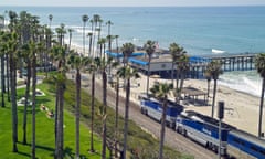 Amtrak passengers speed past the San Clemente pier in southern California.