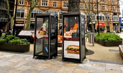 Two phone boxes in poor state of repair