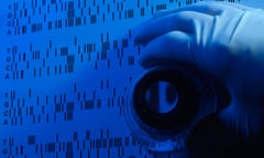 a dna sequence being studied using a magnifying loupe