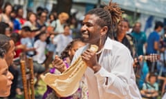 Afro-Peruvian musician Jos Ballumbrosios playing a quijada instrument, or donkey jaw.