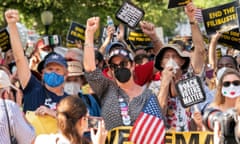 People participate in a rally to support voting rights at the Texas sate capitol in Austin.