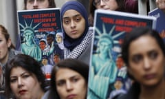 Demonstrators listen to speakers during a rally outside the U.S. 4th Circuit Court of Appeals Tuesday Jan 28, 2020, in Richmond, Va. President Donald Trump’s travel ban on travelers from predominantly Muslim countries is going back before a federal appeals court. On Tuesday, the 4th U.S. Circuit Court of Appeals in Richmond will hear arguments in three lawsuits filed by U.S. citizens and permanent residents whose relatives have been unable to enter the U.S. because of the ban. (AP Photo/Steve Helber)