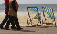 two women walking along the beach