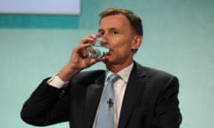 British Chancellor of the Exchequer Jeremy Hunt drinks water at the Resolution Foundation, in London, Britain December 4, 2023. REUTERS/Hollie Adams