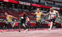 Jonnie Peacock (right) dips for the line to claim a share of bronze in the T64 100m