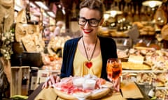 Woman with traditional a spritz and Italian appetiser