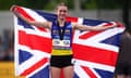 Phoebe Gill holds up the Union flag to celebrate her win in the 800m