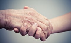 Elderly hand and caregiver