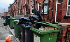 Bins line a street