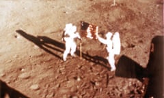 Neil Armstrong and Buzz Aldrin deploy the US flag on the lunar surface during the Apollo 11 lunar landing mission. 