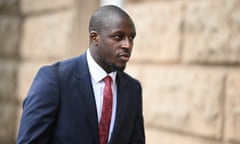 Benjamin Mendy in a suit and tie outside court.