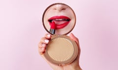 Woman,Applying,Lipstick,Looking,At,Mirror,In,Hand.,Red,Lips<br>Woman applying lipstick looking at mirror in hand. Red lips makeup closeup.; Shutterstock ID 686325277; purchase_order: -; job: -; client: -; other: -