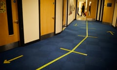 Social distance markings in a corridor as schools prepare to reopen to children.