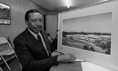 Floyd McKissick poses with an architect’s rendering of the Soultech 1 industrial park.