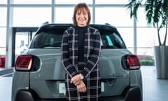 Alison JOnes with a Citroen SUV in showroom