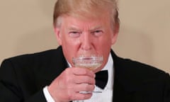 Donald Trump drinks during a state banquet at the Imperial Palace in Tokyo