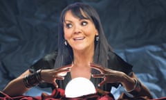 Martine McCutcheon with her hands over a glowing crystal ball