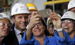 French President Emmanuel Macron poses for a selfie at the STX shipyard site in Saint-Nazaire, western France.