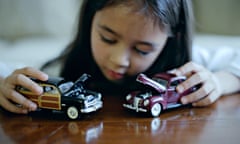 Girl plays with toy cars<br>C00DCC Girl plays with toy cars