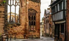 A street in Coventry, showing the destroyed Cathedral from second world war bombs