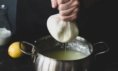 Squeezing a ball of cheese to extract whey