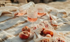 wine and peaches by the sea picnic outdoors in sunset Still life of picnic with wine glasses and rose in summer sunset