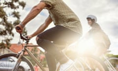 Two people riding bikes