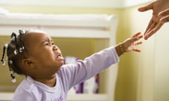 African girl crying and reaching upward