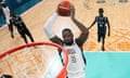 LeBron James, of the United States, goes up for a dunk against South Sudan in a men's basketball game at the 2024 Summer Olympics, Wednesday, July 31, 2024, in Villeneuve-d'Ascq, France. (AP Photo/Mark J. Terrill, Pool)