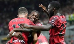 Rafael Leão lifts Christian Pulisic in the air after the American scored against Torino