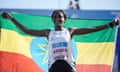 Tigist Assefa celebrates after crossing the finish line to win the women's division of the Berlin marathon in world record time on Sunday.