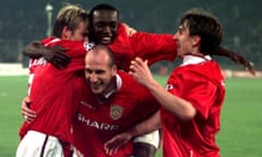 Manchester United players Dwight Yorke (centre), David Beckham (left) Jaap Stam (bottom) and Gary Neville celebrate their victory.
