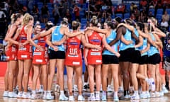 NSW Swifts and Melbourne Mavericks players huddle