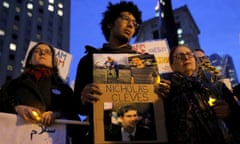 Chancey stands with a sign featuring his friend and attack victim Cleves during a vigil in Foley Square in Manhattan<br>Bahij Chancey (C) stands with a sign featuring his friend, New York West Side Highway pickup truck attack victim Nicholas Cleves, during a vigil in Foley Square in Manhattan, New York, U.S. November 1, 2017. REUTERS/Andrew Kelly NO RESALES. NO ARCHIVES