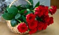 Red roses in a wicker basket