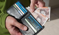 Close up of man person taking new £10 ten pound notes English money banknote banknotes from a wallet