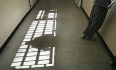 Inmate looks out of the window of  young offenders institution