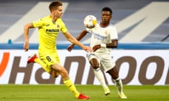 Real Madrid’s Vinícius Júnior and Villarreal’s Juan Foyth compete for the ball