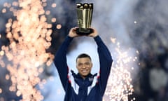 Kylian Mbappé celebrates with a trophy marking his 201 goals for PSG. He has overtaken Edinson Cavani as the club’s all-time top scorer.