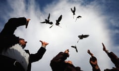 Bulgarian doctors placed in the sky pigeons during a national protest.<br>epa02455674 Bulgarian doctors release pigeons during a national protest in front of the parliament building in Sofia, Bulgaria, 19 November 2010. Hundreds of Bulgarian medics are requesting a more consistent government policy in the sector. In particular they have been frustrated over chronic problems in state funding for healthcare and the unwillingness of the government to pay due arrears.  EPA/VASSIL DONEV