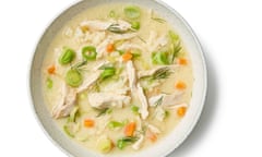 A bowlful of avgolemono soup, with shards of chicken, and bits of carrot, leeks and dill