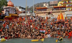 Hindu devotees take a holy dip in the Ganges during Shahi Snan at Kumbh Mela