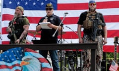 US-WEAPONRY-GUN-RIGHTS-DEMONSTRATION<br>Kyle Rittenhouse (C), speaks while surrounded by security at the Defend Our Second Amendment: Michigan's fight for Self Preservation rally, held in a farm field in Ionia, Michigan, on July 19 2023. In 2021, the Capitol Commission in Michigan banned the open carry of weapons within the Capitol building, and is expected to vote on a full ban by its August meeting. Members of the group Sons of Liberty PAC created the Defend Our 2A: Michigan's fight for Self Preservation rally to protest the ban, saying that people's rights in Michigan are being eroded. (Photo by JEFF KOWALSKY / AFP) (Photo by JEFF KOWALSKY/AFP via Getty Images)