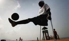 Sierra Leonian's Survive In One Of The Worlds Poorest Countries<br>FREETOWN, SIERRA LEONE - NOVEMBER 26:  A member of the Freetown Single Limb Amputee football team practises on Lumley Beach on November 26, 2006 in Freetown, Sierra Leone. Nearly all the players were victims of Sierra Leone's brutal civil war that ended in 2002.  (Photo by Chris Jackson/Getty Images)