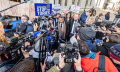 Immigration lawyer Toufique Hossain, centre, celebrates victory outside the supreme court after it rejected the government’s Rwanda plan, 15 November 2023.