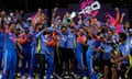 India's head coach Rahul Dravid (centre) and his players celebrate with the winners trophy after their victory against South Africa