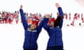 Gold medalist guide Jennifer Kehoe and skier Menna Fitzpatrick jumping on the podium after winning gold for Great Britain